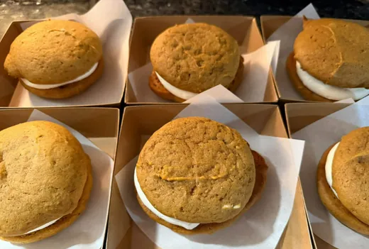 Pumpkin whoopie pies filled with vanilla buttercream, boxed one per box